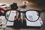 glasses and magazines by Ewan Robertson on Unsplash.com